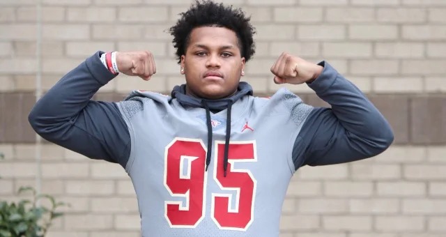 A 2027 Colorado defensive line commit poses during a recruiting visit.