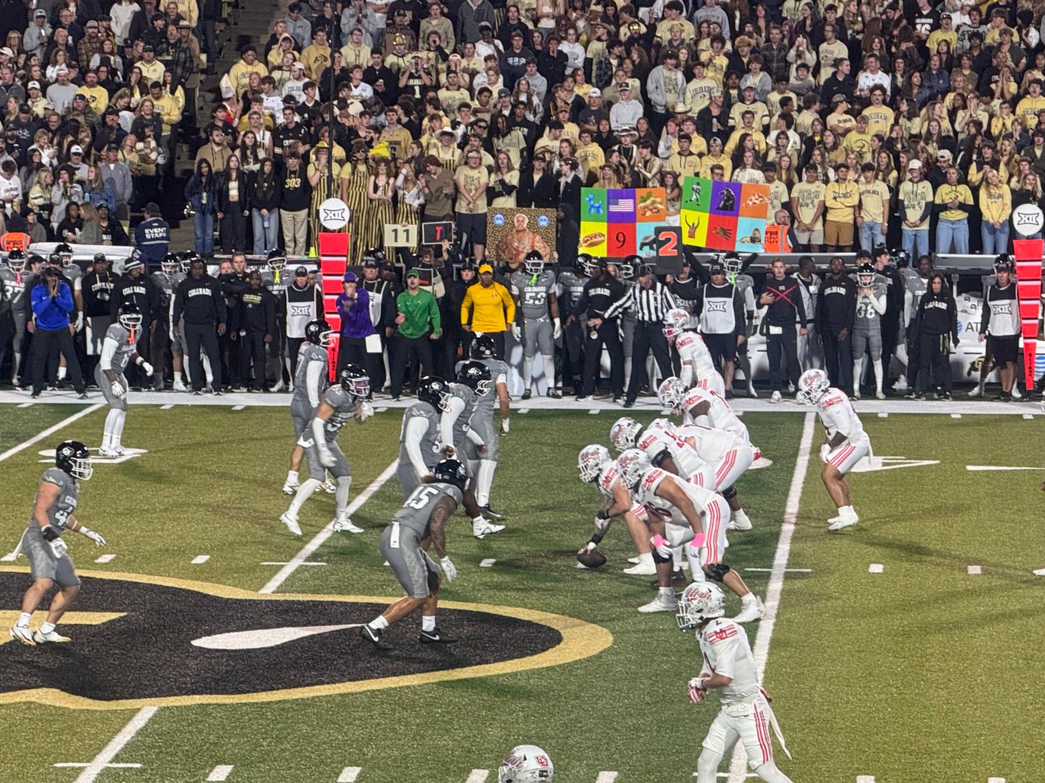 Colorado's defense lines up against Utah in front of the student section at Folsom Field.