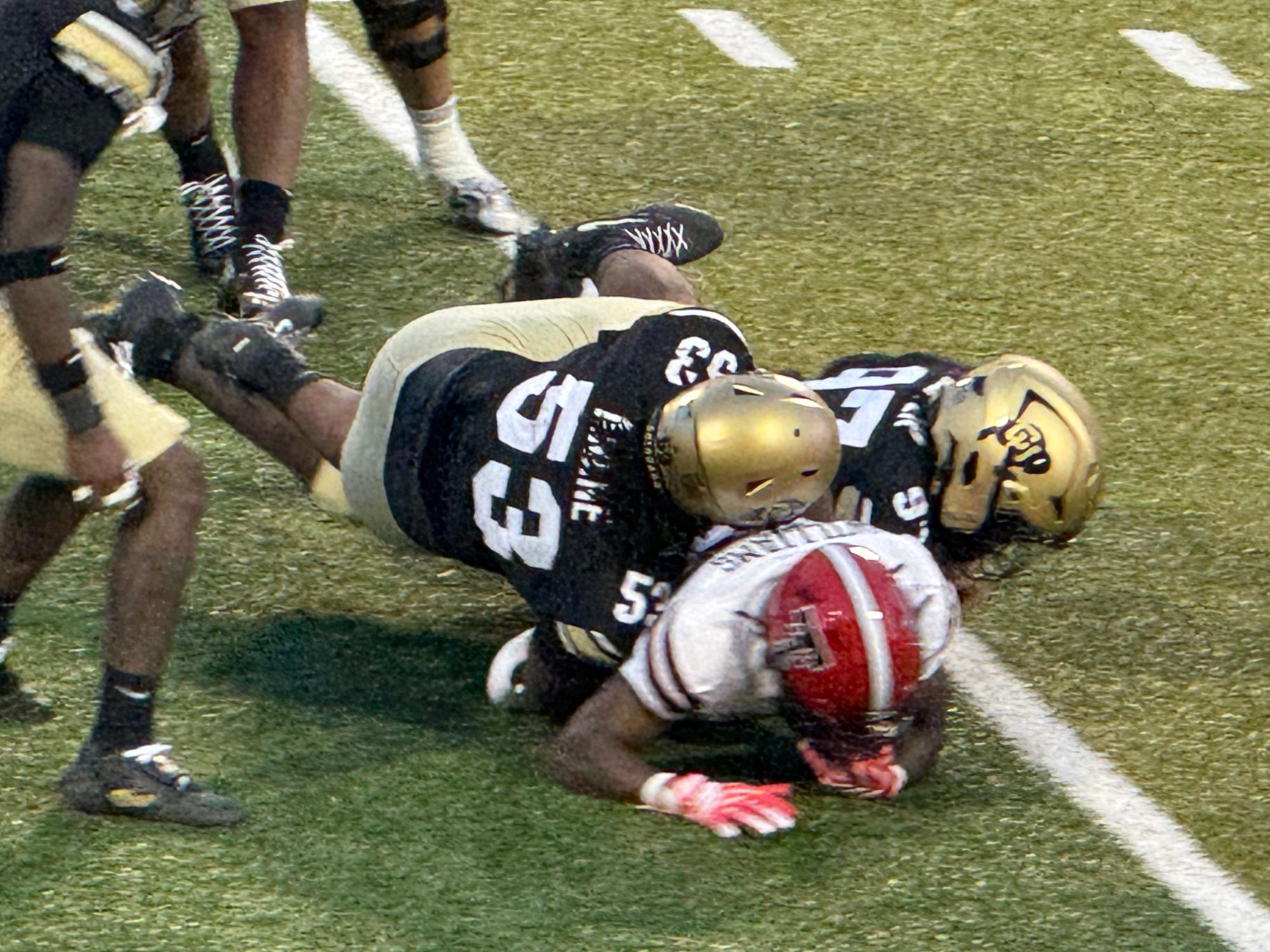 Colorado linebacker Toby Anene, No. 53, bringing down a Texas Tech ball carrier during the Buffaloes' 29-7 loss at Folsom Field.