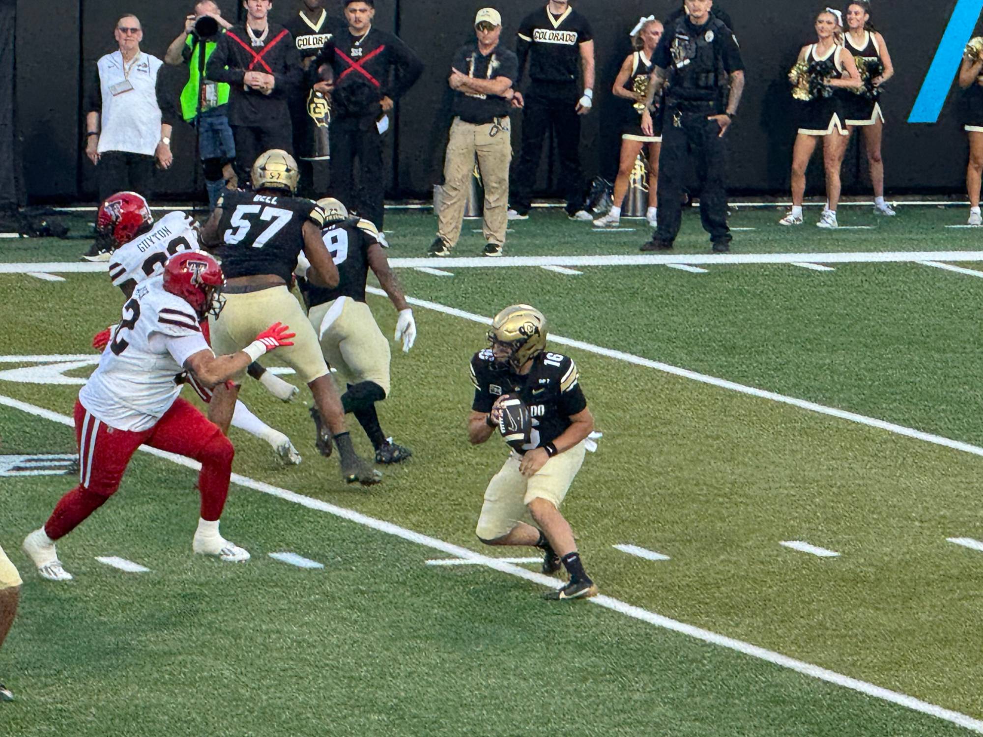 Colorado quarterback Isaac Wilson, No. 16, dropping back to pass behind right tackle Leon Bell against Texas Tech at Folsom Field.