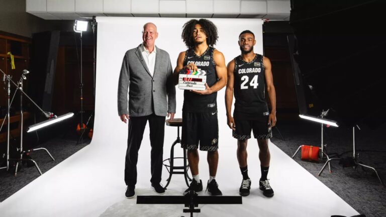 Tad Boyle with two Colorado men's basketball players at media day